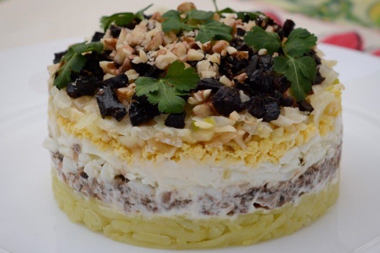 Layered Salad with Potatoes, Sprats, Prunes, and Nuts