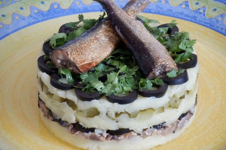 Layered Sprat Salad with Pickled Cucumbers, Olives, and Potatoes