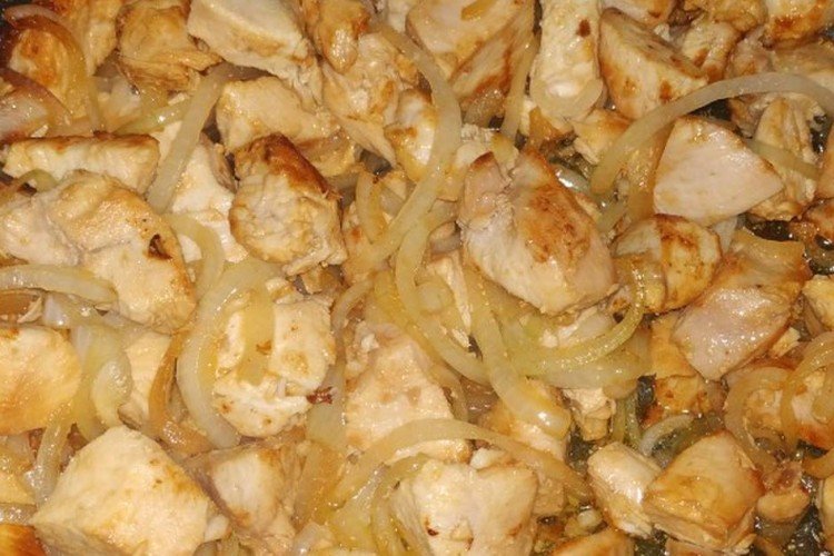 Chicken Meat Baked with Spices on an Onion Bed