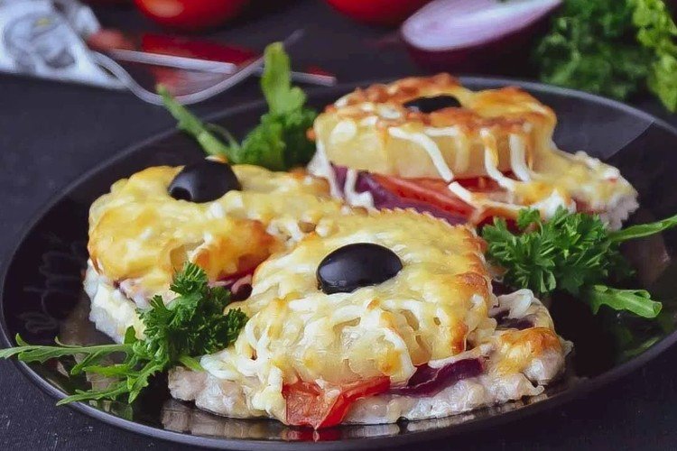 Meat Baked with Pineapples, Tomatoes, and Cheese