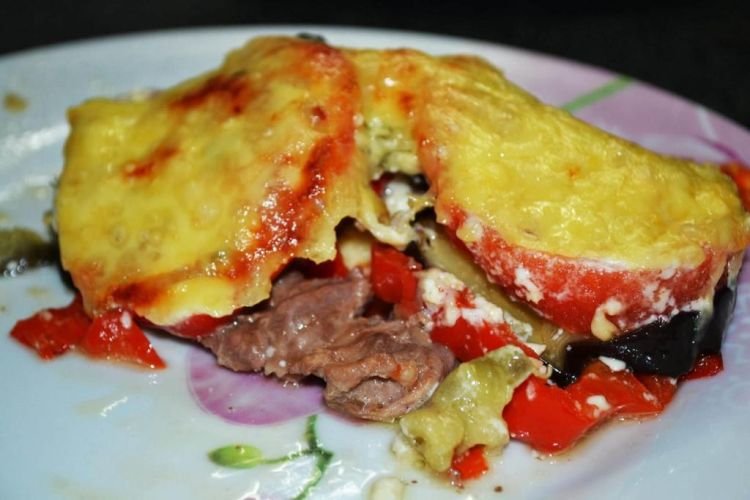 Pork Chops with Eggplant, Tomatoes, and Cheese in the Oven