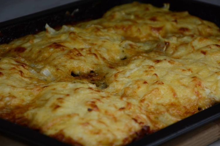 Pork Chops Baked with Potatoes, Onions, and Cheese