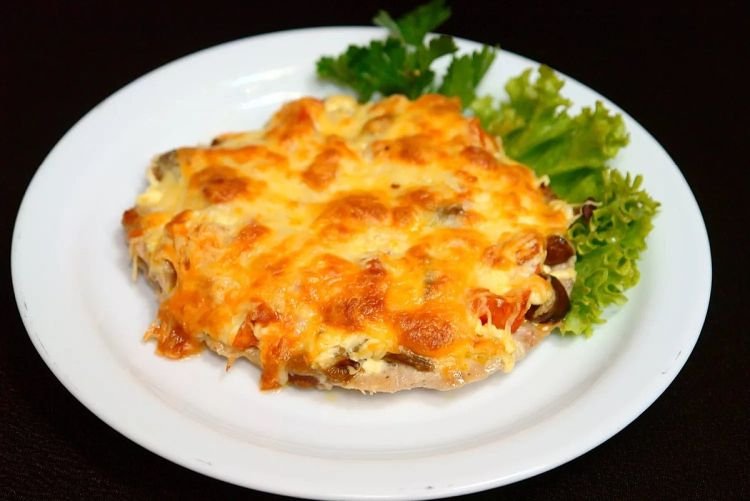 Pork Chops with Mushrooms, Onions, and Cheese in the Oven