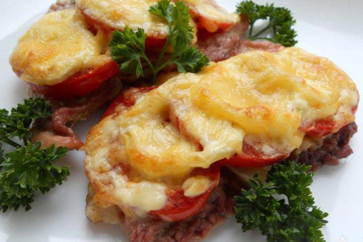 Pork Chops with Tomatoes and Cheese in the Oven
