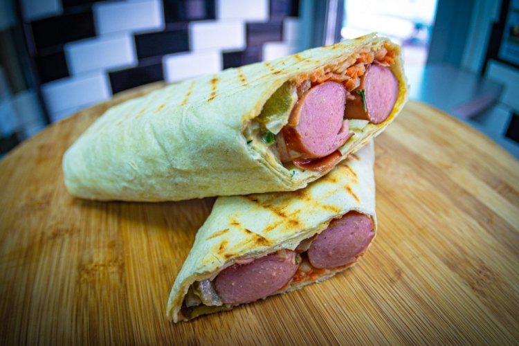 Hot Dog with Pickled Cucumbers and Green Onions in Lavash