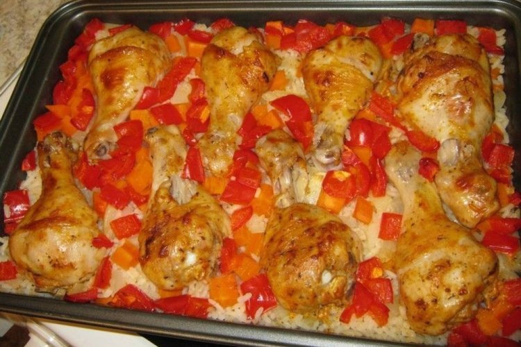 Chicken Drumsticks with Rice and Tomatoes in the Oven