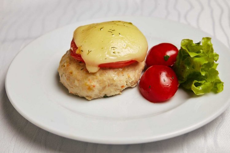 Chicken Cutlets with Tomatoes and Cheese in the Oven
