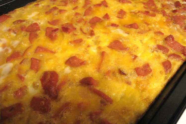 Patatas ralladas con salchichas al horno