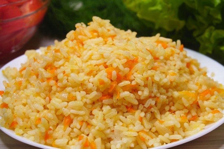 Rice with Carrots and Onions in a Skillet