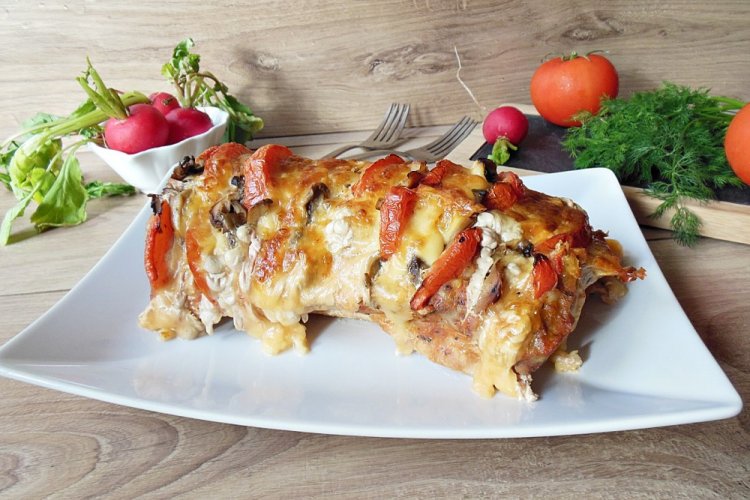 Cerdo con tomates y queso al horno