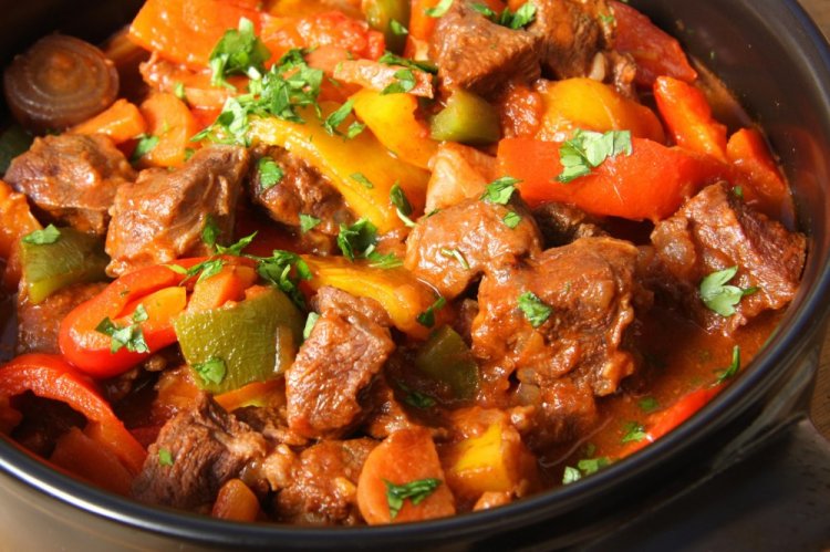 Pork with Zucchini and Tomatoes in a Skillet