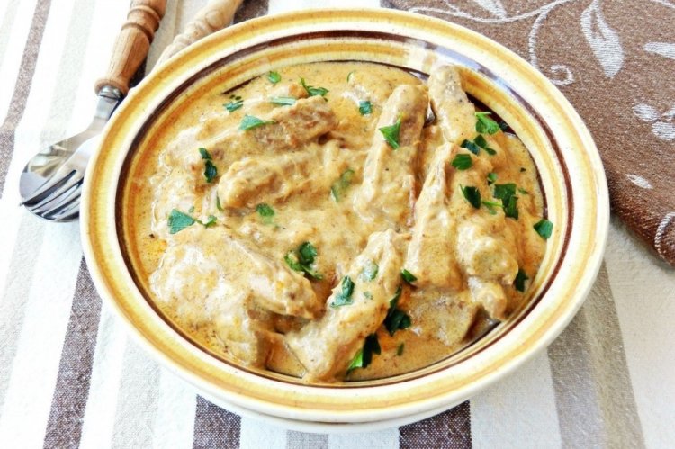 Pork with Vegetables in Sour Cream in a Skillet