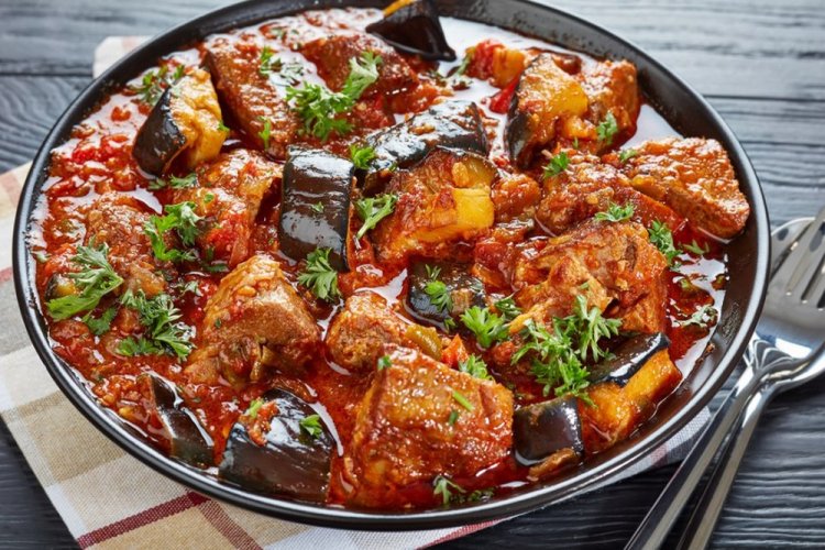 Pork with Vegetables in Tomato Juice in a Skillet
