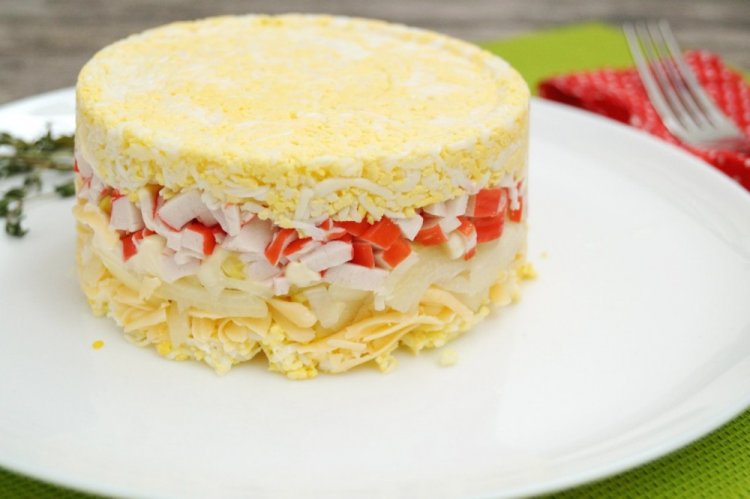 Layered Salad with Crab Sticks and Pineapple