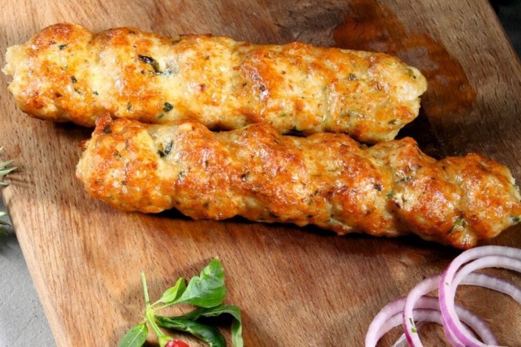 Chicken Lyulya Kebab with Cheese and Herbs on the Grill