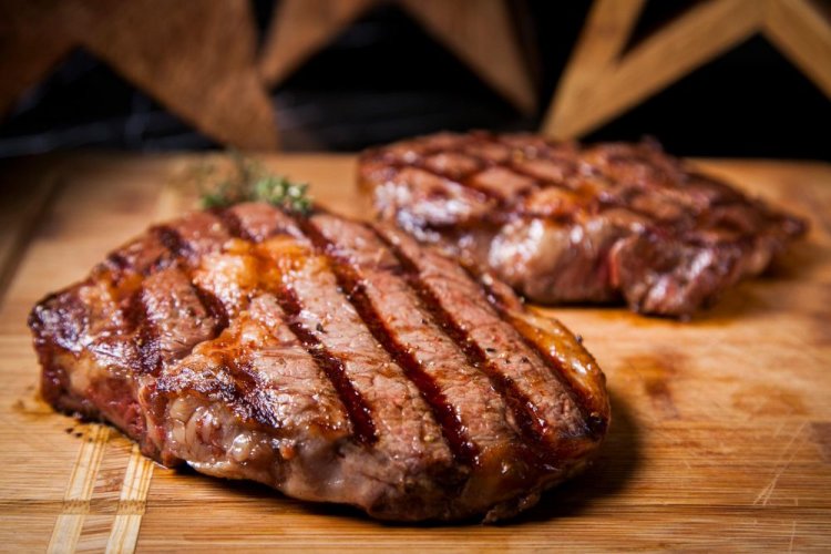Beef Steaks in White Wine and Orange Marinade on the Grill