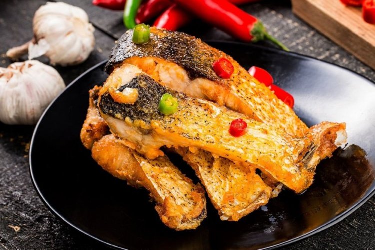 Carp Pieces with Garlic, Baked in Foil on the Grill