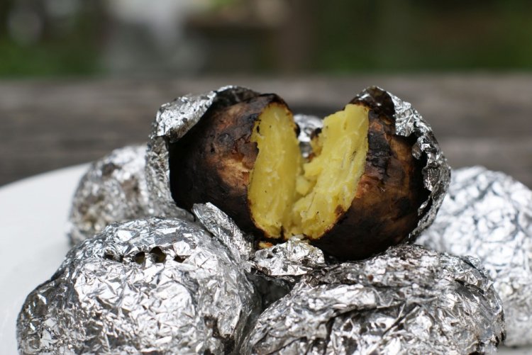 Potatoes with Butter in Foil on Coals