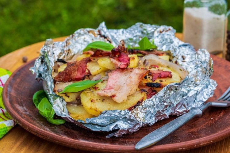 Potatoes with Onion and Bacon in Foil on Coals
