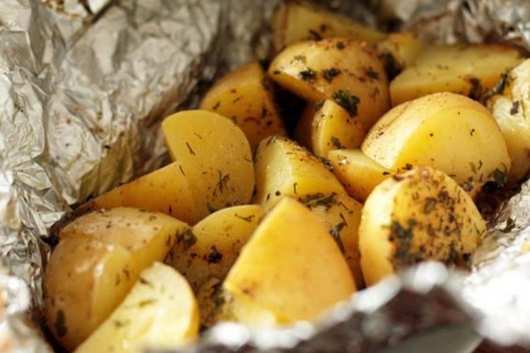 Potatoes with Lemon and Herbs in Foil on Coals