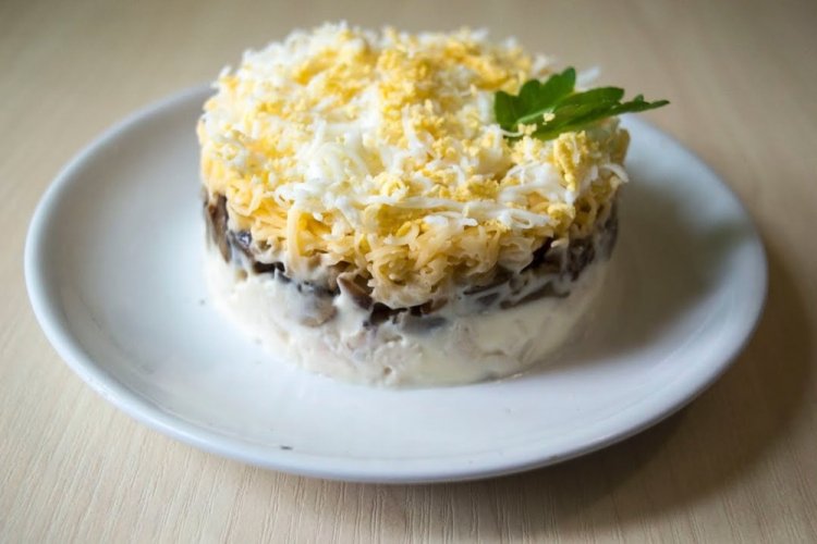 Layered Salad with Fried Mushrooms, Chicken, Cheese, and Prunes