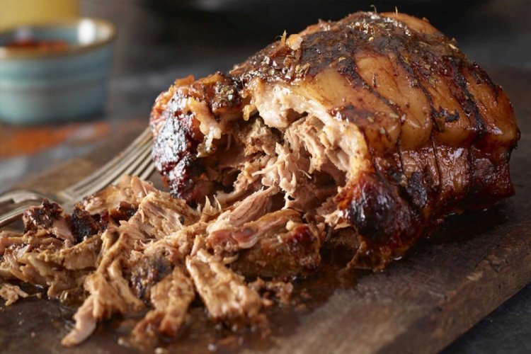 Slow-Cooked Pork Shoulder on a Rack in the Oven