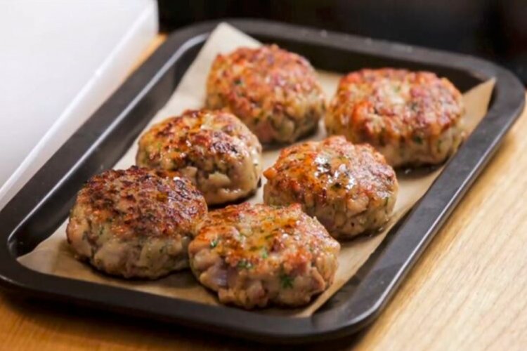 Potato Cutlets on a Baking Sheet in the Oven