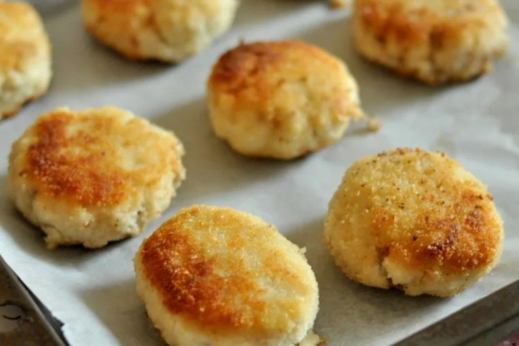 Fish Cutlets on a Baking Sheet in the Oven