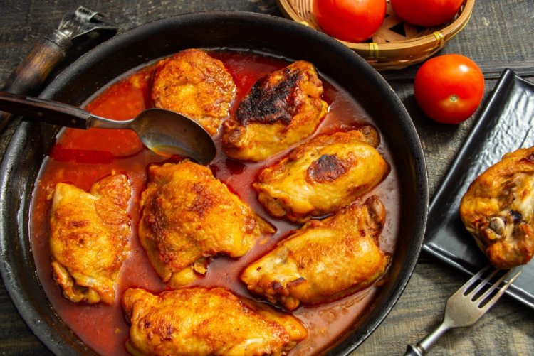 Chicken Thighs in Tomato Sauce in a Skillet