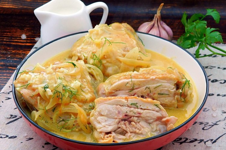 Chicken Thighs with Onions and Sour Cream in a Skillet