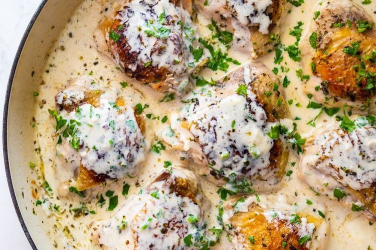 Chicken Thighs in Cream Sauce in a Skillet