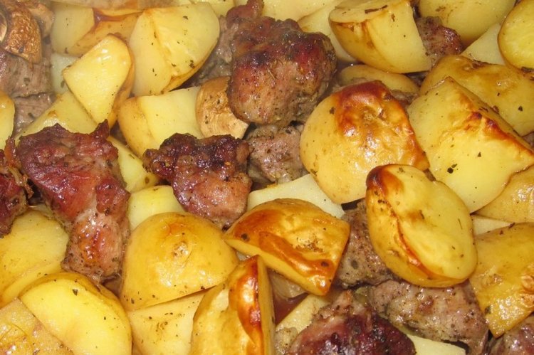 Meat with Potatoes in Soy Sauce on a Baking Sheet