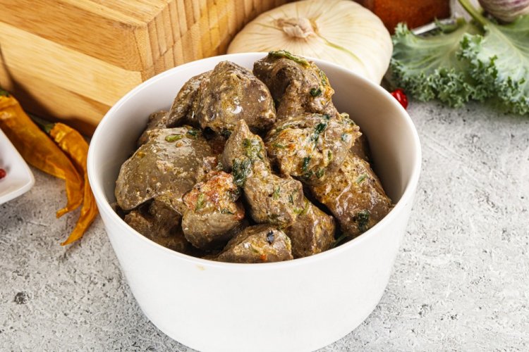 Chicken Liver with Nuts in Sour Cream in a Skillet