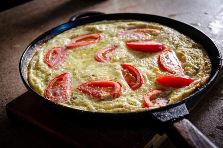 Fried Potatoes with Meat and Tomatoes under Cheese