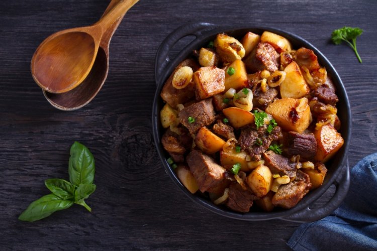 Fried Potatoes with Onions and Meat in a Pan