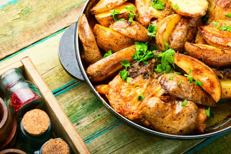 Fried Potatoes with Onions and Chicken in a Pan