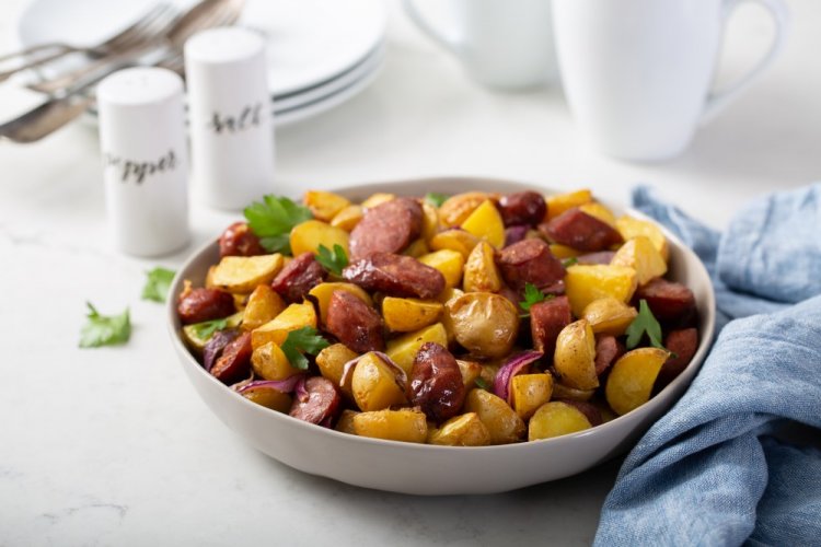 Fried Potatoes with Onions and Sausages in a Pan