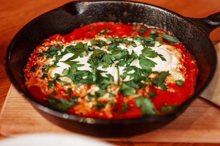 Cauliflower with Tomatoes and Eggs in a Skillet