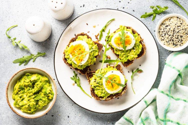 Sandwiches with Black Bread, Avocado, and Egg