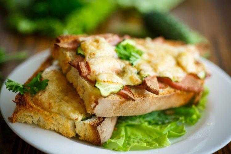 Hot Sandwiches with Sausage, Pickled Cucumbers, and Cheese