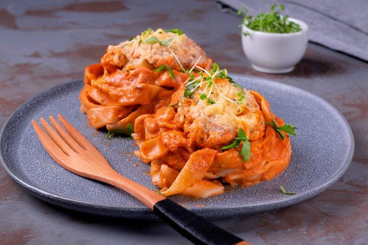 Pasta Nests with Minced Meat, Cheese, and Tomato Sauce in the Oven