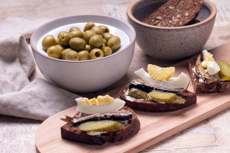 Sandwiches with Sprats, Pickled Cucumbers, and Quail Eggs
